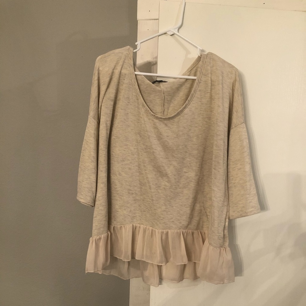 Cream/tan ruffle blouse.